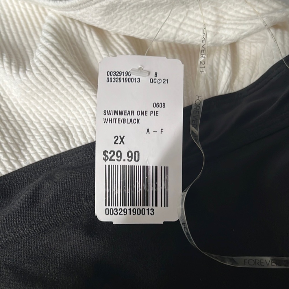 Brand new Plus size swimwear one piece white/black. Tag still on.